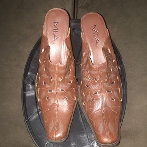 Dark brown leather Western style mules.